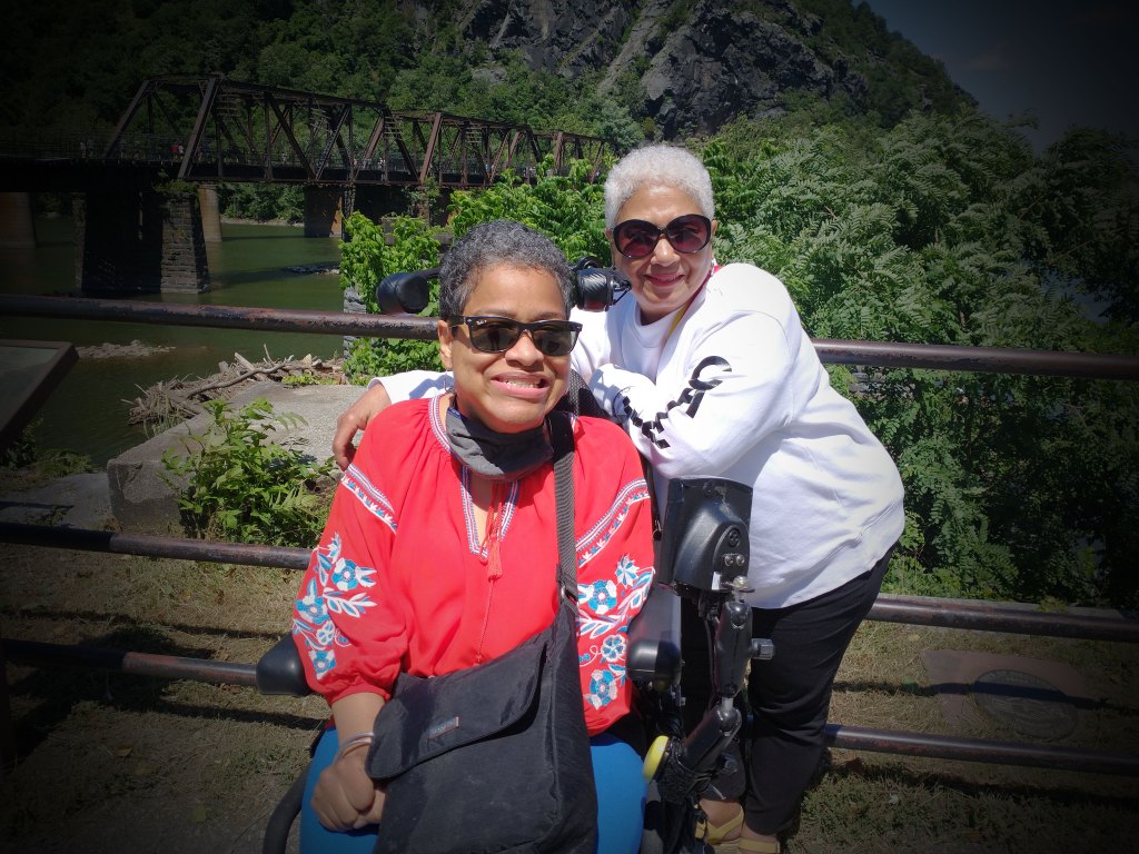 A mother and poses for a picture at a Team Trust Productions' video shoot.