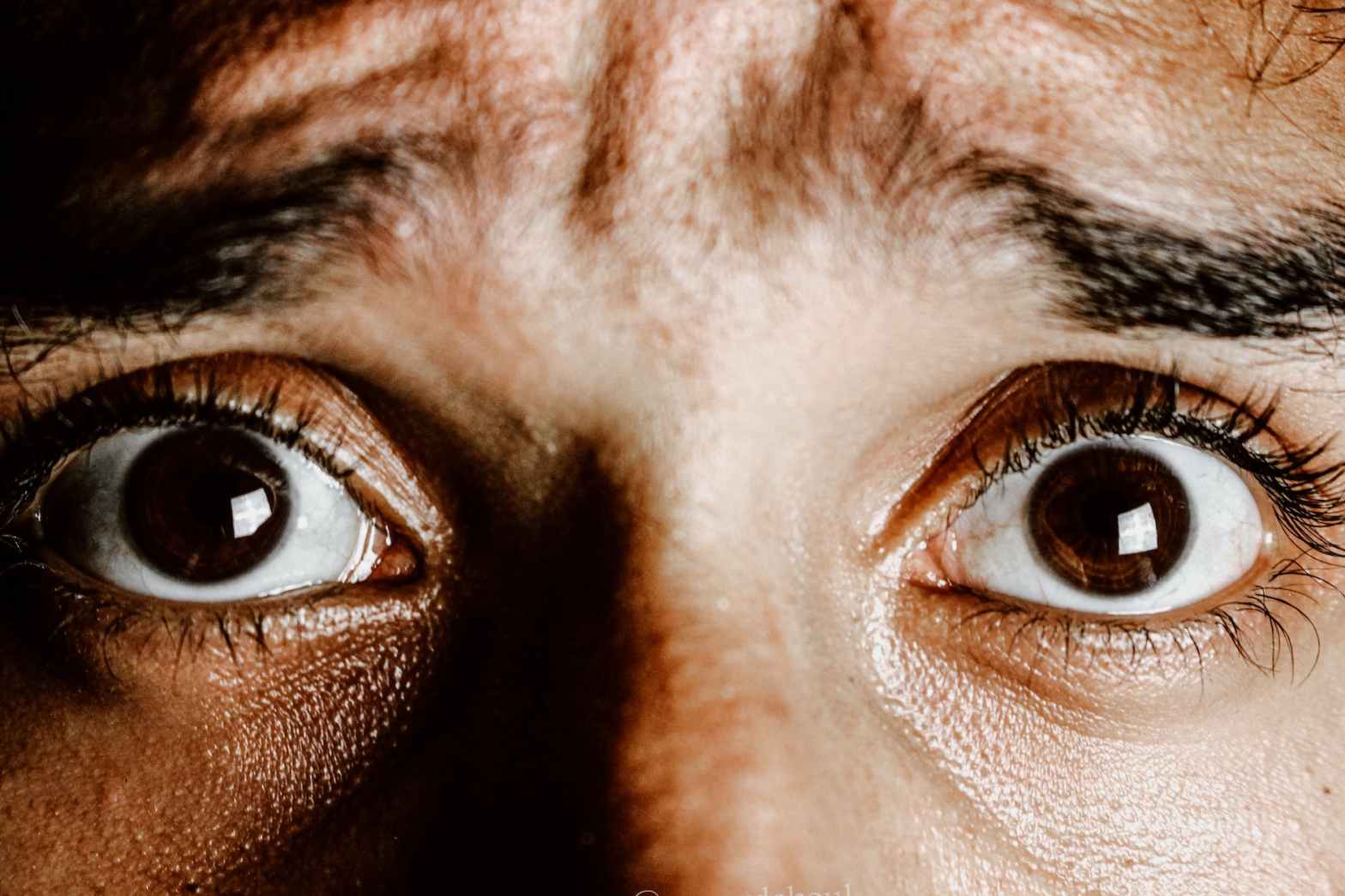 extreme close up photo of frightened eyes