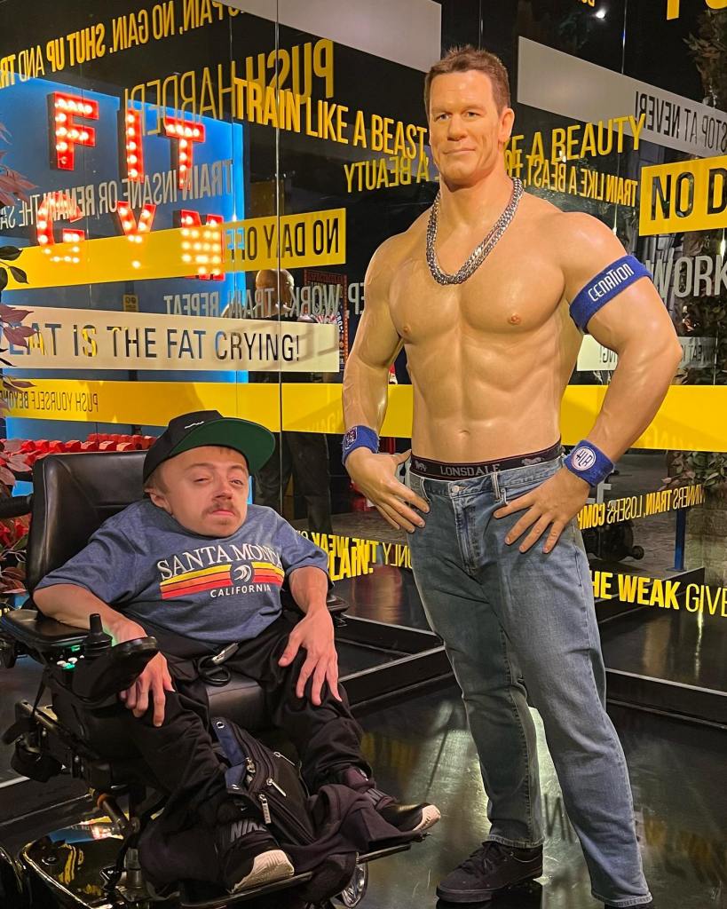 Team Trust Productions CEO Ryan Wilson poses for a picture with a wax figure of John Cena in Los Angeles.
