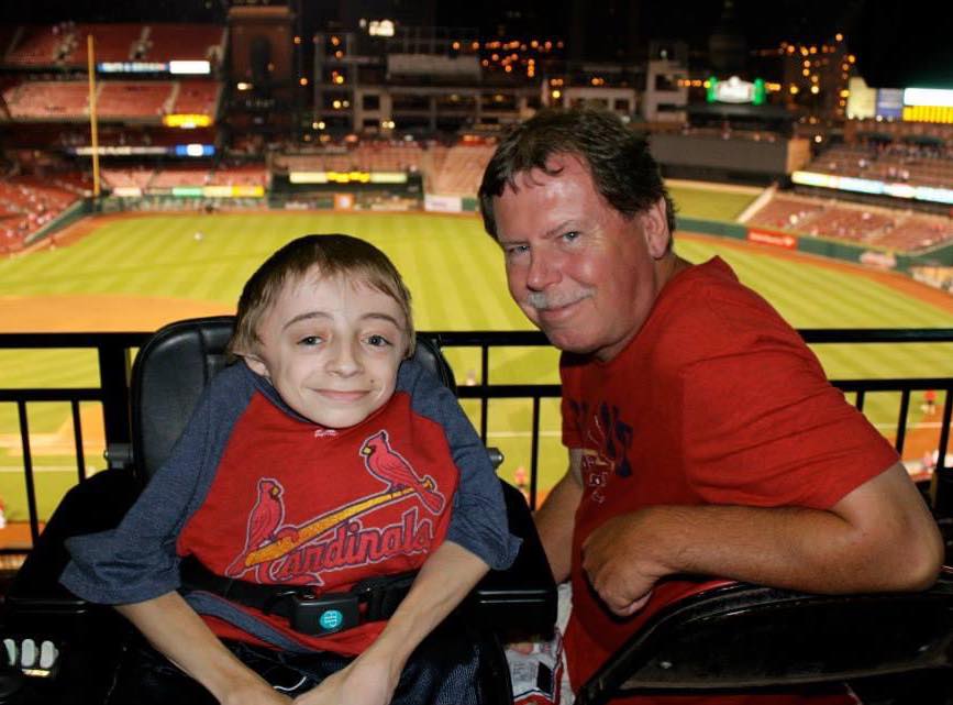 Team Trust Productions CEO Ryan Wilson poses for a picture with his father at a St. Louis Cardinal's game.