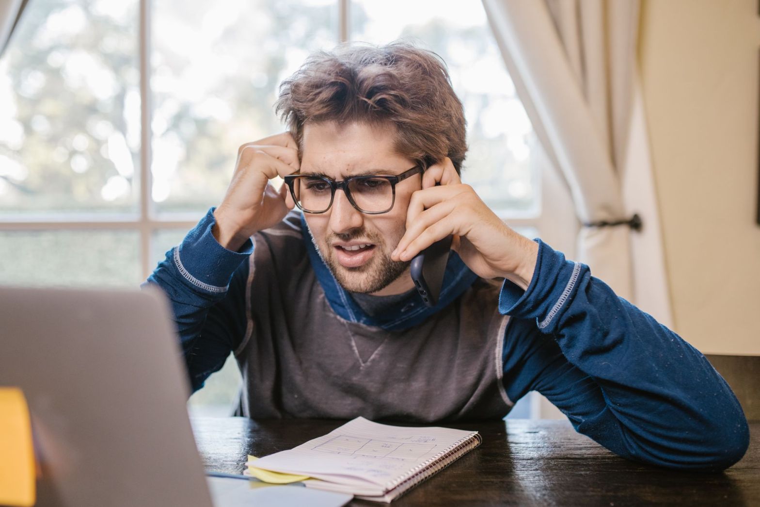 confused man looking at the laptop screen