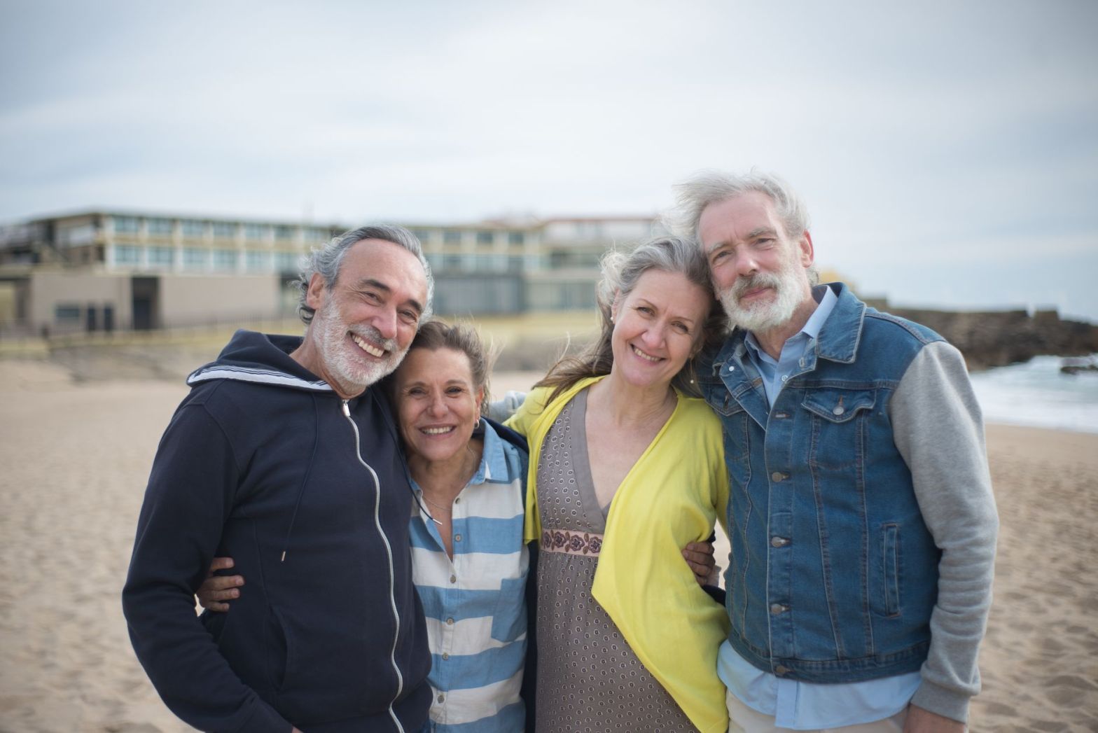 a group of mature people standing close to each other
